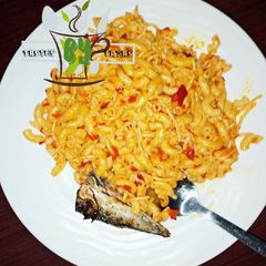 A picture of Pepperd Pasta served with fish.