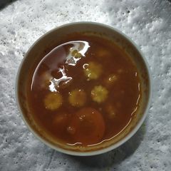 A picture of Tomato corn soup.