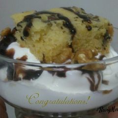 A picture of Vanilla Ice-cream with Walnut Mawa Cake.