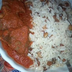 A picture of Rice and beans with beef stew.