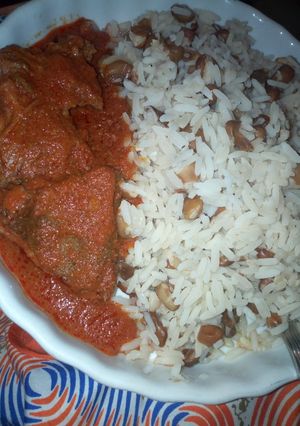 A picture of Rice and beans with beef stew.