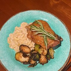 A picture of Sous Vide Turkey Thigh w/ a Béchamel Mac n Cheese and deep fried Brussel Sprouts.