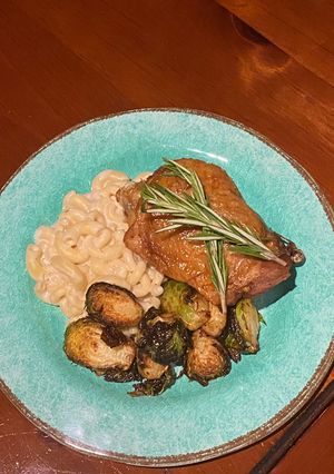 A picture of Sous Vide Turkey Thigh w/ a Béchamel Mac n Cheese and deep fried Brussel Sprouts.
