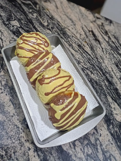 A picture of Chocolate Lemon glaze doughnuts.