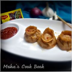 A picture of Steamed Momos with masala e magic.