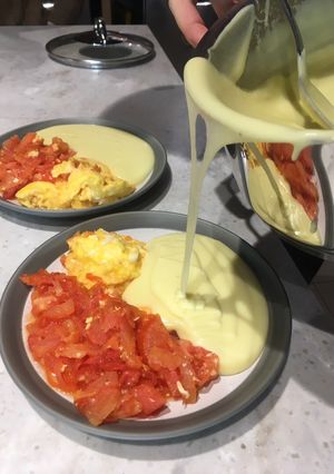 A picture of Mashed potatoes (sided with tomato eggs) 🥔.