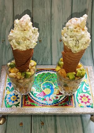 A picture of Fruit salad in Ice cream cone.