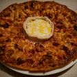 Pizza casera y queso fundido