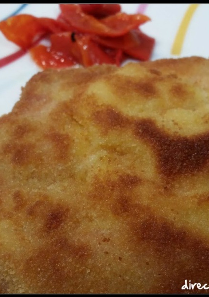 Una foto de San Jacobos de lomo con queso y pimientos