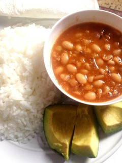 A picture of Yellow beans with boiled rice.