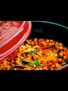 A picture of Tunisian chickpea stew with carrots and kale.