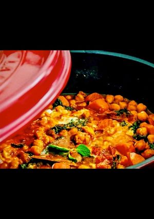 A picture of Tunisian chickpea stew with carrots and kale.