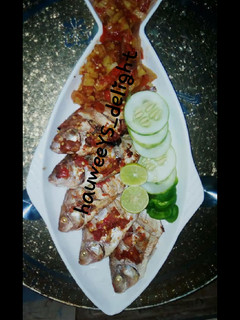 A picture of Grilled fish and sauce.