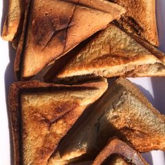 A picture of Toast bread with sardine.