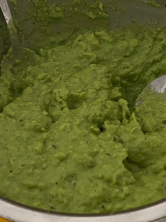 A picture of Guacamole with bread toast.