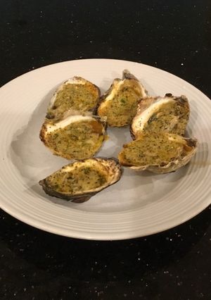 A picture of Grilled Oysters With Garlic/Romano Herb Butter.