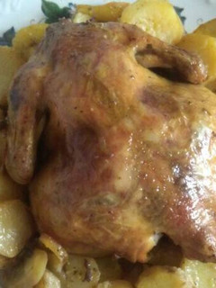 Una foto de Pollo al horno con patatas