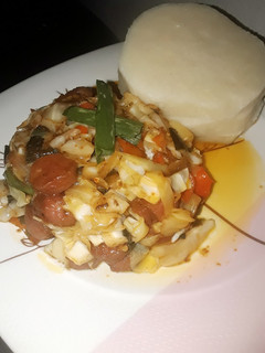 A picture of Boiled yam with cabbage sauce.