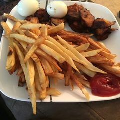 A picture of Fries and shrimp sauce.