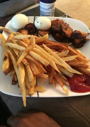 A picture of Fries and shrimp sauce.