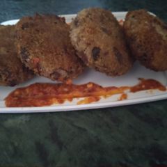 A picture of Arancini bean patty Mexican style.