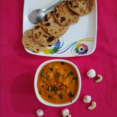 Besan masala stuffed mini paratha with cashew makhana curry A picture of Besan masala stuffed mini paratha with cashew makhana curry.