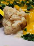 Coliflor con salsa de queso y azafrán