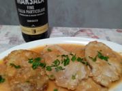 Una foto di scaloppine maiale