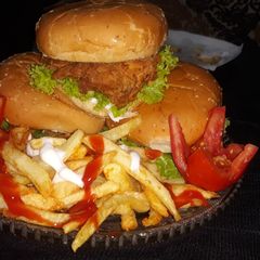 A picture of Crispy Zinger burger 🍔with crispy fries 🍟.
