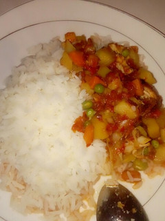 A picture of White rice with potatoe sauce.