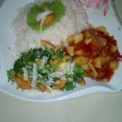 A picture of White rice and potatoe soup.