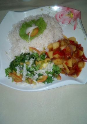 A picture of White rice and potatoe soup.
