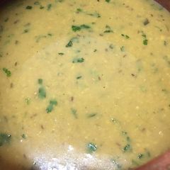 A picture of Mong masoor ki dal with rice/paratha.