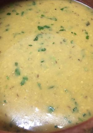A picture of Mong masoor ki dal with rice/paratha.