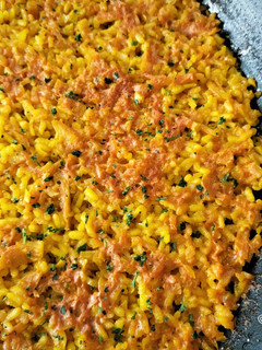 Una foto de Paella de bacalao y coliflor