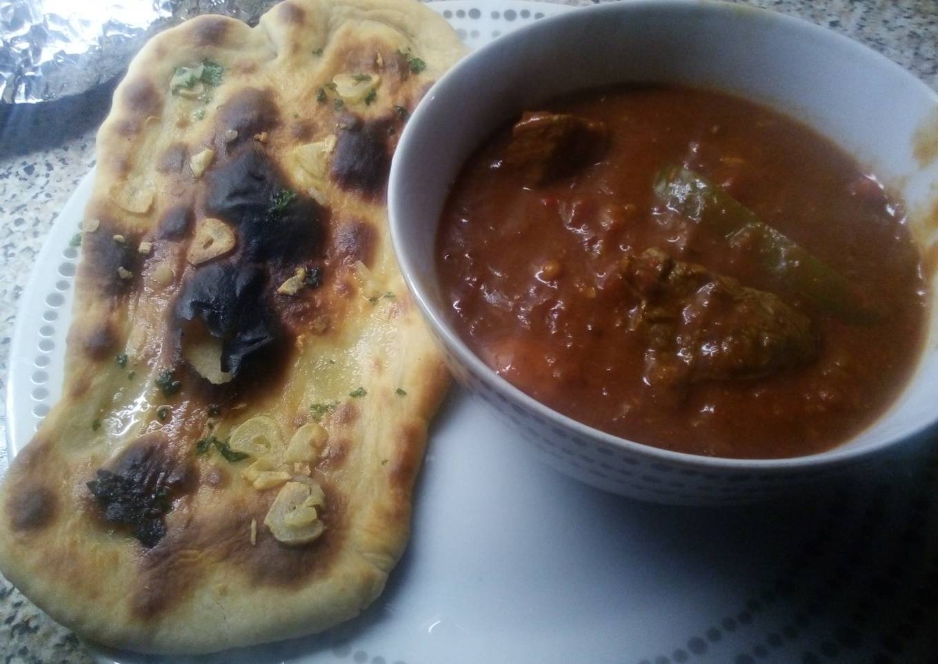 Beef Madras with garlic naan bread