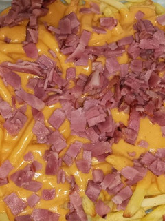 Una foto de Patatas fries bacon y cheese del McDonald's 🍟🧀🥓