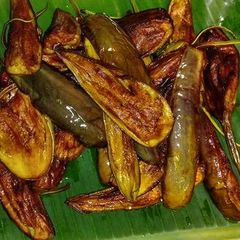 A picture of Fried Brinjal or Begun Bhaja in Bengali Style.