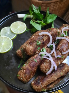 A picture of Mutton Kebab with leftover meat and rice.