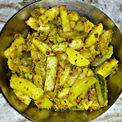 A picture of Potol Aloo Posto (Potato pointed gourd fry with poppy seeds).