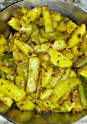 A picture of Potol Aloo Posto (Potato pointed gourd fry with poppy seeds).