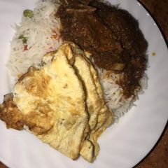 A picture of Vegetable white rice and stew with egg.