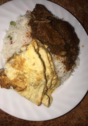 A picture of Vegetable white rice and stew with egg.