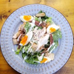 A picture of Beer can chicken Caesar salad skinny dressing version.