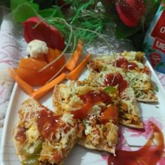 A picture of Cauliflower & Paneer stuffed chapati pizza.