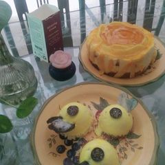 A picture of Mango cheese cake and mango mousse balls.
