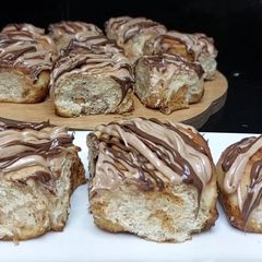 A picture of Cinnamon rolls with nutella frosting.