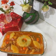 A picture of Grilled pineapple chicken with vegetables.