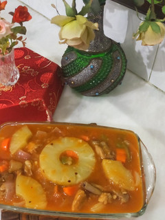 A picture of Grilled pineapple chicken with vegetables.