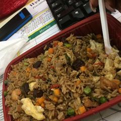 A picture of Jollof rice with vegetables.